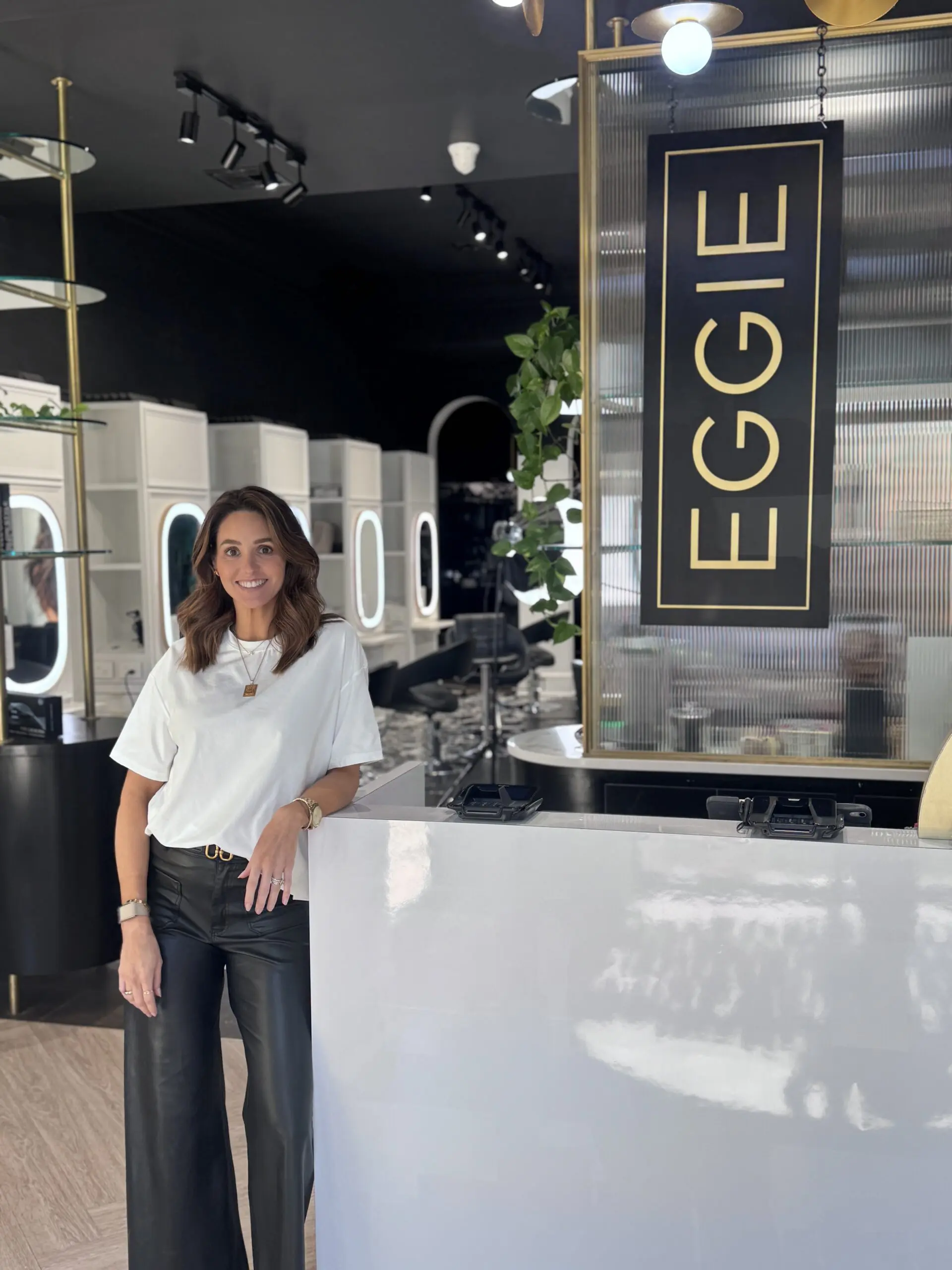 Owner of EGGIE Salon, Rachel at the front desk